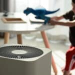 air purifier in living room with kid playing