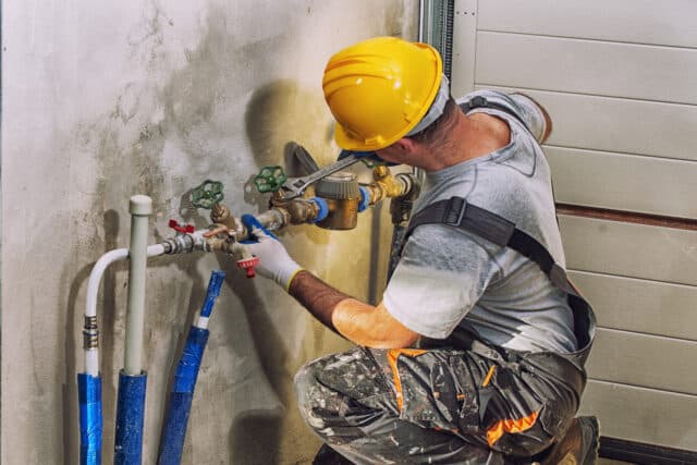 Professional plumber fixing residential plumbing issues