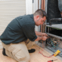 Man installing a new heating system