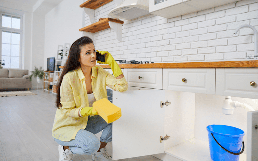 Woman calling a professional plumbing company to schedule a service appointment