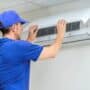 Technician installing a heat pump system.